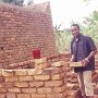 John helps building the toilets.